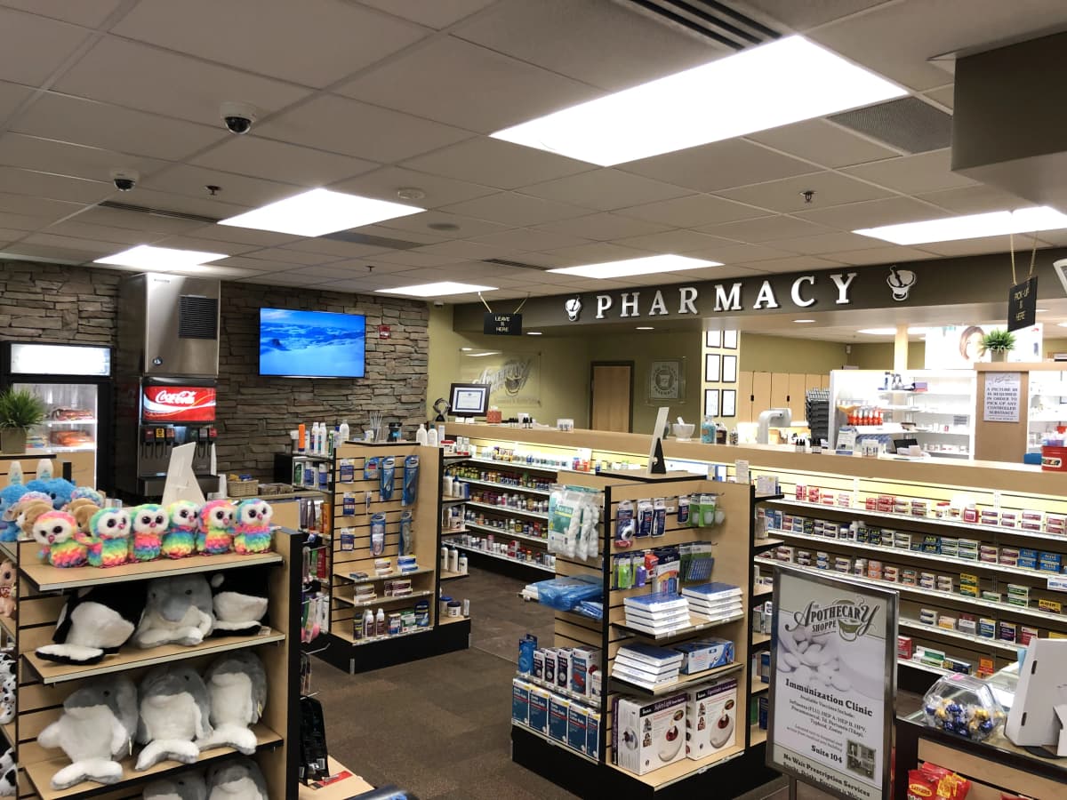 Pharmacist answering customer questions